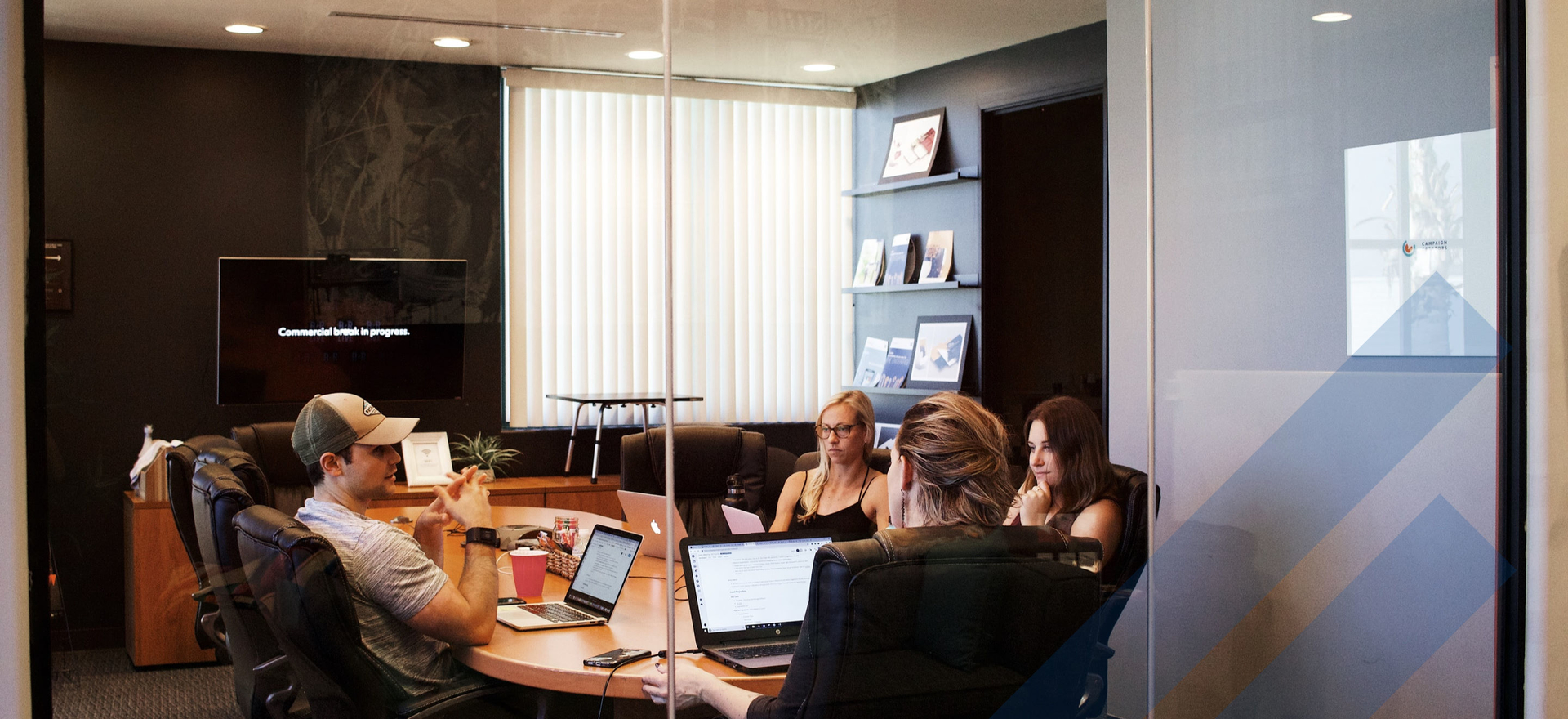 young people sitting at a conference table